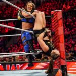 Ronda Rousey Instagram - Damn we look good in gold @qosbaszler 🥇🥇 And my hair is a special kind of fantastic while cranking on @katana_wwe’s arm 💇🏼‍♀️thank you @thisisbabe ! #TagTeamChamps #AndStill