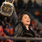 Ronda Rousey Instagram - Damn we look good in gold @qosbaszler 🥇🥇 And my hair is a special kind of fantastic while cranking on @katana_wwe’s arm 💇🏼‍♀️thank you @thisisbabe ! #TagTeamChamps #AndStill