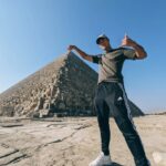 Ross Butler Instagram - I've always been fascinated with Egypt. As a kid I was obsessed with Egyptian history and mythology. I wanted to be an archaeologist, explore tombs, find scarabs living in buried pots, brush dirt off skulls of mummified pet animals. But who would have ever thought I'd be able to pick up an entire pyramid from just the tip. Thanks to my personal trainer for getting me so swole. Man the tone of this caption really went astray. Great Pyramid of Giza