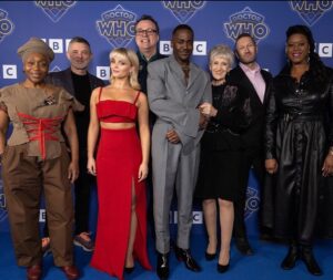 Russell T Davies Instagram - CHRISTMAS DAY, BBC One & Disney+, The Church on Ruby Road. Meet the team! Angela Wynter as Cherry Sunday, Joel Collins Exec Producer, Millie Gibson as Ruby Sunday, RTD, Ncuti Gatwa IS the Doctor!, Anita Dobson as Mrs Flood, Phil Collinson Exec Producer and Michelle Greenidge as Carla Sunday. Goblins not pictured. @bbcone @bbciplayer @disneyplus @bad_wolf_tv 🟦➕🎄