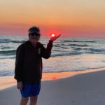 Sam Bush Instagram – Sun in hand, toes in the sand! Sam enjoying some well deserved beach time as 2023 winds down.