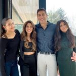 Sangita Patel Instagram - This photo was taken an hour before I said YES 💍 I just got my Engineering degree the day before and then Sam whisked me away to Bahamas. Little did I know he had already met with my family and asked for their blessing 🥰 (my sisters kept a secret from me, how dare they 😂) Sam got on one knee (same height as me when he kneels😊) I was complaining about the bugs on the beach and missed the whole ‘will you marry me’ I’m pretty sure I said Holy 💩 20 YEARS! The moments, the memories, the ride….what 👏🏽 an 👏🏽 incredible 👏🏽 ride! I think the best way to explain the carousel is K-I-S-S-I-N-G nursery rhyme, remember?! First come love ❤️ then comes marriage 💍 Then came Ava and Shyla in a baby carriage 🍼 Oh and Indie 🐶 Happy 20th Anniversary Sam (still checking you out, hubba hubba 😉❤️ #20thWeddingAnniversary #Myjoy #Mylife #laughter