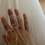 Sasha Clements Instagram - It’s easy to forget our progress! I documented my entire flare up just so I'd have references to look back on and i’m so happy I did! I couldn’t fit this ring on for almost a year (I tried every day). ⁠ ⁠ This week has presented some tough challenges and even though my fingers are still sore and I can see where I’m still swollen, I’m beyond grateful for the reminder that there has been improvement!🙏🏼⁠ ⁠ A little background- I was diagnosed with RA over 10 years ago. Was treated with Methotrexate and went into “remission”. Meaning my swelling and severe pain went down but I never really got better. I was still achy & sore. Had major brain fog & exhaustion to the point Corbin made me test for narcolepsy. I was always dealing with inflammation/ infections. I was constantly breaking out into rashes and hives and would be on Prednisone multiple times a year. So I was in "remission" but I wasn’t thriving - I was surviving. ⁠ ⁠ When I flared up again I was once again diagnosed with RA - then Lupus - then they added Lyme. With more testing we found I had high levels of mercury & lead, high toxic exposure, activated EBV, major vitamin deficiencies, hormonal imbalances, and mitochondrial dysfunction. ⁠ ⁠ I’ve been on a few different meds all with their lovely side effects🙄 Some have helped but I didn’t want to repeat the same pattern of just putting this bandaid on the pain. So here are some other things that have helped immensely!⁠ ⁠ -Working with a functional medicine doctor & getting testing done though them. Finding a mentor to guide me. I eat ZERO processed food, sugar, gluten, dairy, legumes, nuts, caffeine. I cook all of my food at home. I’ve tried many diets - AIP, low salicylate, carnivore, paleo, vegan, pescatarian and I found the trick is to just create your own diet prescription- your body knows what it needs. I take a rainbow of supplements, upped my water intake, practice gratitude, meditation, food combining, hot & cold therapy (sauna & cold showers), fasting, breath work, stretching, exercise, juicing, a wind down routine, & get good sleep.⁠ ⁠ It's a lot and wasn't achieved overnight but each layer you add will only get you closer to healing ❤️⁠ ⁠