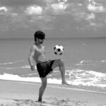 Siddharth Nigam Instagram - Beach boy🌧️✨ Doing some flipping 🤸🏻‍♂️ and dribbling ⚽️ @kayak_in ✨