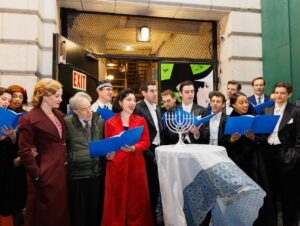 Sierra Boggess Instagram - The cast of @harmonyanewmusical celebrating Hanukkah outside the Barrymore Theatre with a menorah lighting, blessings and songs 🕎💙

Photos: Paul Aphisit