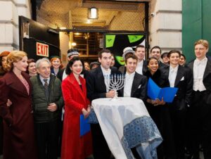 Sierra Boggess Instagram - The cast of @harmonyanewmusical celebrating Hanukkah outside the Barrymore Theatre with a menorah lighting, blessings and songs 🕎💙

Photos: Paul Aphisit