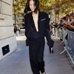 Stella McCartney Instagram - STELLA’S SUSTAINABLE MARKET: In the streets of Paris post-show with our Stella girls. New #Frayme bags are crafted from an organic linen knotted mesh, grown without pesticides and less water than cotton. Its trimmings are in an apple waste-based #vegan alternative to leather, with a recycled lining. Watch the #StellaSummer24 runway show at stellamccartney.com. Credits Wearable art by @AndrewLoganSculptor, exclusively for Stella McCartney #StellaMcCartney #ParisFashionWeek #PFW #StellasSustainableMarket