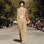 Stella McCartney Instagram - STELLA’S SUSTAINABLE MARKET: A play with proportions. Cropped tailcoats and waffle-knit vests over volume trousers, slim and roomy trenches, tiny #Falabella triangles and #Frayme bucket bags in knotted hemp mesh. Watch the #StellaSummer24 runway show at stellamccartney.com. Credits Wearable art by @AndrewLoganSculptor, exclusively for Stella McCartney #StellaMcCartney #ParisFashionWeek #PFW #StellasSustainableMarket Marché Saxe-Breteuil