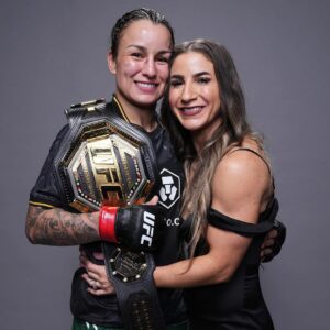 Tecia Pennington Instagram - Queen 👑 I want to be like you when I grow up 🏆🖤 #ProudWife #ProudFriend #ProudTeammate #TeamRocky #UFC297 #WorldChampion #RockNado