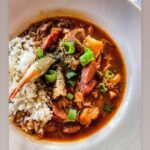 Tiffany Derry Instagram - Christmas Eve is almost here and that means we packing up Gumbo and Coquito for you to share with your family. If you haven’t placed your order yet at @rootssouthtable you about to miss out because cut off time is tomorrow. Stop what you doing and place your orders now every year y’all try to hunt me down saying you forgot to place your order and could I squeeze you in. I love y’all but it you don’t place that order online you won’t have it. Remember it comes cold we will also put your rice on the side and all you have to do is heat everything up. There is enough for 4 normal bowls of gumbo but the pros always get two half gallons so there’s leftover!! Pick up is Christmas Eve and all info on Roots Website under Shop. The link in bio!!! Roots Southern Table