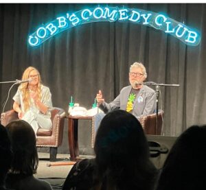Timothy Omundson Instagram - One year ago, tonight, my podcast partner in crime, @magslawslawson and I  did our very first  @thepsychologistsarein  LIVE SHOW  to a sold out crowd @sf_sketchfest !  And now ,  just one year later, we are about to embark on a cross country tour  of 8 cities ( so far) with our show  thanks to all of you amazing people who have  been  supporting our  love letter to Psych both by listening to the podcast and coming out to see  us  on the #PsychPodTour24 Happy Bithday to us. Thanks to you 2024 is going to be huge , starting FEB 3rd, right back where it all began  at @sf_sketchfest we couldn’t do any of this without the incredible work of our amazing producer, @devinruskin  see all y’all on the road 💛💚🍍🍍