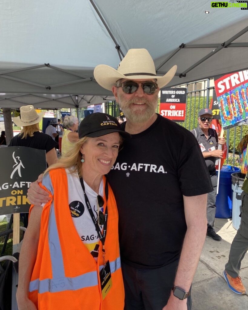 Timothy Omundson Instagram - It’s Strike Captain Appreciation Day on the @sagaftra Picket lines and I could not be more proud or appreciative of THIS particular 🧑‍✈️, my dear friend and colleague, the incredibly dedicated , @nelsonkirsten . She is the most wonderful Strike mom And aprotector of all her actors. each morning for the last 98 days, she has been out the door , leaving her family, home and all of her life’s regular responsibilities to stand in the Summer heat of the valley, and wrangle cats , fighting for a #fairDeal. our strike Captains, like our Negotiation Committee are the unsung heroes of our struggle against the Greed Monsters Who still refuse to come back to the table and engage with their workers. They must be too busy planning their next ski vacations and redecorating their yachts. We will stay on strike, one day longer, one day stronger. For as long as it takes to get a #Fair Deal ✊🏻✊🏻#UnionStrong ABC/Disney Studios