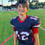 Tom Brady Instagram - My son Benny, can you believe it? Fourteen years old already! It seems like yesterday you were running around in your superhero cape, and now you’re definitely a superhero to me ❤️ You’ve grown so much, and not just in height (seriously, watch out @gronk) You’ve grown in kindness, smarts, and all-around awesomeness. Your ability to make people laugh, your knack for solving problems, and your endless debating skills 🤣 make you a force to be reckoned with. We love you so much. You are a blessing to us all and we adore you! P.S. No, you can’t stay up until 3 AM playing video games now that you’re 14. Nice try tho 🤣
