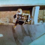 Tony Hawk Instagram - Frontside air, Oasis halfpipe. 1980: Dogtown Triplane, [@mikesmithsliberty’s old] Indy’s, Blood Wheels & gardening gloves. Fun / frightful fact: Oasis was directly under the freeway overpass that leads 805 south to 8 east. People used to throw bottles at us as they drove by, leaving glass shards in the bottom of the bowls. Wheels and kneepads were no match for for such sharp slivers. The park closed not long after this photo was taken. Mission Valley East, San Diego