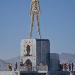 Vadhir Derbez Instagram - 🇲🇽Me tarde, pero ahí les va una probada de Burning Man, fue una experiencia loquisima pero me encantó. -Foto 1: En medio de la Playa (así le dicen al centro de la ciudad donde está todo el arte) y yo pos estoy dando el mame haciendo como que no me doy cuenta, ya tu sabe jaja -Foto 2: Un letrero random que describe como terminas con polvo hasta donde no. -Video 3: Nadie sube mucho de las calles de BM de Noche, así que quise mostrar lo loco que se ve todo cuando cae el sol. Las bicis y locales tienen luces de colores por todos lados y se siente muy... como Futuro Apocalíptico jaja -Video 4: Andando en bici y en el centro de la ciudad esta un Hombre hecho de madera, que al final de la semana lo queman, por eso se llama Burning Man! -Foto 5: Esta fue parte de mi familia en BM y luego subo foto de los demás, pero la pasamos increíble. Esto fue nuevo para todos nosotros y shockeante pero creo que esta experiencia cambió nuestra perspectiva de la vida y sociedad. Gracias por leer! Si acabaste todo comenta un 🦖 jaja . 🇺🇲I took so long to post but here it is! A lil taste of my experience in Burning Man which was... insane. -Picture 1: I'm in the middle of the Playa (which is how they call the center of the city where most of the Art is) and I'm just casually posing trynna act cool, acting like I'm walking away lol iykyk. -Picture 2: A random sign that described very well how you truly got dust in places dust shouldn't be in.. lol -Video 3: Most people don't post pictures of the streets at night in BM, so I wanted to share a bit of the craziness. All the bikes and camps got colored lights and everything glows. It feels very futuristic but apocalyptic at the same time. -Video 4: Me riding towards "The Man" This awesome instalation of a Wooden man in the center of it all. And at the end of the week everyone gathers to watch it Burn 🔥, Hence "Burning Man". -Picture 5: This was part of my Burning Man Fam.(I'llpost pics of the others soon). This was new to us all and I truly believe it changed our perspective on society and the way we treat people.  It was shocking but mind-blowing. Thanks for reading 😊 if u finished comment a 🦖 Black Rock City