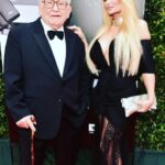 Yvette Rachelle Instagram - 🌈🥲As I write this tears fall down as my dear friend, great buddy and movie Co-Star #EdAsner said his final goodbye today. Thanks dear friend for all our funny and fabulous times we shared on set, having dinners where we would laugh and tell jokes way past your bedtime, hitting all the #Hollywood #Emmys #HBO #universalpictures #redcarpet (You always tripping on my long dress and saying “why didn’t you just wear a mini dress “lol), helping me rehearse my lines for our #universalstudios film #santastoleourdog where I play an Elf and you would say “I was second best #Elf Actor to #willferrell and I am calling Director #JonFavreau as you need to be in his next movie God Damn it!” On our love of animals saving wolves , bison and wildlife together for #defendersofwildlife (and don’t worry Ed I will keep saving the Bison for you as that was your favorite)and us being #doglovers -on set we would compare pictures of our cute puppy dogs and Ed would brag his dog was always the cutest-his was a Bulldog! There are so many candid photos and every time we spoke I would always write down your funny jokes as you were the funniest guy I ever met and I didn’t want to forget your funny jokes!I know you would say stop crying my beautiful friend so I will for a second so I can post this and go call you in Heaven 😇 Farewell my sweet friend as you really weren’t the curmudgeon people say you were but a kind and sweet soul… Hugs #yvetterachelle