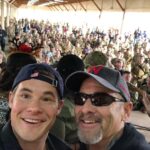 Adam Devine Instagram - HAPPY FATHERS DAY! here’s a pic of me and my pops in Iraq on Christmas Day on a @USO tour. We’ve done a lot of cool things together and been on plenty of adventures but this one was a favorite. You are my sounding board, my confidant, my best friend, my rock. I love you Dad. My dad was diagnosed with Lung Cancer in April and to say it has put myself and our family in a tail spin would be a gross understatement. Hug your fathers and tell them you love them and if they’re happy and healthy count you blessings. Camp Taji Airbase