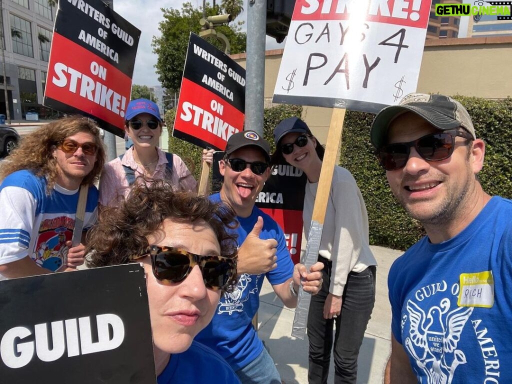 Adam Devine Instagram - I asked for a sign and they said “we have the perfect sign for you”. THEY WERE RIGHT! It’s important that the gays and non gay WGA writers get paid!!!