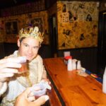 Adam Devine Instagram - So this past Sunday I was the King of Bacchus! One of the biggest Mardi Gras parades in New Orleans! It was an incredible honor and maybe one of the coolest experiences of my life. Thank you to John and Anna Beth Goodman, The Brennan family, George Grimes and everyone who made this unbelievable experience happen for myself, my family, and friends. Hail Bacchus!!! 🙌 1) as this King I had rain down plastic beads for the people! Sorry if I hit you in the face but hey it’s Mardi Gras baby! 2) My family came out to support and we partied all night in a convention hall with 9500 of our new best friends. God I love New Orleans. 3) Blake was there and we went hard. As we do. 4) All the homies got to ride on the float directly behind me and shower the people with jewels (plastic beads). 5) Had to take a shot with the best bud @atibaphoto before strapping myself in for the 4 hours of parading. 6) A past king was there! @anthonymackie. He gave me advice on being a good king. (Throw tons of beads). 7) practicing the previous Kings advice. 8) @chloebridges the Yas Queen and her court partied (took tons of photos) as we paraded. 9) Took time to thank the military before getting on the float. It ‘‘twas the Nobel thing to do! 10) The King and his Court. Some old and some less old. Damn did we have a good time! New Orleans, Louisiana