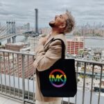 Adam Lambert Instagram - Support the @stonewallvisctr as we preserve LGBTQ+ history, honor the pioneers of the past, and ignite inspiration for the future. Starting June 20, claim your piece of history with the incredible Michael Kors x SNMVC bag at select Michael Kors locations 🌈 Dive into an immersive preview of the upcoming Stonewall National Monument Visitor Center, opening its doors in 2024. Every purchase fuels the SNMVC's transformative work. Discover more at @stonewallvisctr ✨ #MeetUsAtTheMonument