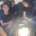 Angela Kinsey Instagram - High School & Middle School here we come! So proud of these 3! Did I tear up? 💯! Do I take the worst photos of any special moment? Yes. (Josh is the photographer in our house.) Did Josh and I high five because we are officially a one school drop off family? Heck yes! Happy back to school everyone! ❤️