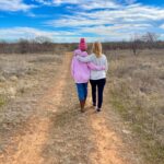 Angela Kinsey Instagram - My sister took this photo of me and Isabel as we walked to the pond today. Thankful to be spending the last day of 2022 with my family in a place I hold so dear. Wishing you all a great New Year! Thanks for hanging out with me here. ❤️
