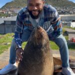 Anthony Anderson Instagram - When you wake up and take an adventure with your brother from another mother @deecamzi It was a great day. I did everything but kiss the seal! We went thru Chapmans peak on the way to cape point. #justakidfromcompton #fromcomptontocapetown #huskyandhandsome #acbarbeque Tamboerskloof, Western Cape, South Africa