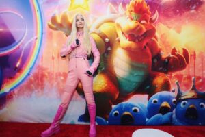 Anya Taylor-Joy Instagram - 🍑Peach came to play🍑

So wonderful celebrating @supermariomovie with so many of you :) 

Big love to @illuminationent @universalpictures , Nintendo and our beautiful cast… and @dior for making me Peachs’ moto suit! Beep beep loveees 🏍

Out April 5th✨