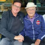 Bob Saget Instagram - HAPPY 99TH BIRTHDAY to the one and only @thenormanlear !!! In this life, if you’re lucky, if you have a handful of friends who mean so much to you. Norman Lear is of course an amazing human being in every way possible. Yes, he changed television forever with the smartest, most poignant and funniest shows ever seen— but everyone and everything he touches, he blesses with his clarity, brilliance, and love. And here he is touching ME! Norman, I treasure you as one of my dearest friends, and love you beyond words— and definitely beyond an Instagram post. Although this is a hell of a picture. Wishing you the happiest and healthiest of birthdays with your incredibly beautiful family. You are loved in the way I’m describing by so many people—Because you LOVE so many people. And to quote your beautiful proclamation, “I love you, and I don’t give a f*ck who knows it!” Happy Ninety-Nine Years Dear Amazing Norman!! ❤️💙