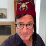 Bob Saget Instagram – Okay, why am I wearing a Fez? Well for the first time ever, since my dad left us for greater pastures, I went through some of his stuff and found some of his treasured accoutrements— He was a very proud Shriner and 32nd degree Mason. For those that know, the Shriners are a society of people who do a lot of philanthropic work and often pay for surgeries for people that don’t have insurance and can’t afford medical care – – For kids and others who’ve needed organs, major super expensive surgeries, and they’ve saved many lives. I just wonder if you have to wear this Fez to do all that. By the way, it is in mint condition. That was my dad, and incredibly kind, smart, and caring man. I wonder if he ever wore this hat.