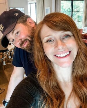 Bryce Dallas Howard Instagram - For those of you following recent bang developments (thank you for your thoughts and prayers 🙏), my bangs are officially tamed! 😅 @misterjasonlow mercifully swung by to work his magic when he was in my neighborhood. ⁣
⁣
[ID 1: A selfie of BDH in her dino-wallpapered bedroom. She smiles in celebration of her freshly cut side bangs.]⁣
⁣
[ID 2: A post-haircut selfie with BDH (right) and the man behind the transformation, Jason Low (left).]