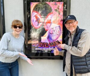Bryce Dallas Howard Instagram - As a former Gwen Stacy, can I just say: RUN DON’T WALK to see “Spider-Man: Across the Spider-Verse”! Bravo to the entire creative team! An astonishing film on every level. My pops and I are already itching for the next! Congrats:)⁣
⁣
[ID: After a mind-blowing movie matinee, BDH (left) and Ron Howard (right) stand on either side of a “Spider-Man: Across the Spider-Verse” poster, giving their smiles and two thumbs up.]