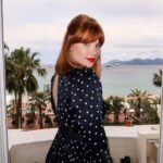 Bryce Dallas Howard Instagram - Happy Cannes-iversary 😘⁣ #CannesFilmFestival ⁣ ⁣ Makeup: @karayoshimotobua⁣ Hair: @jennychohair⁣ Styled by Publicist Extraordinaire: @alex.schack ⁣ Clothes: @khaite_ny & @vitafede purchased secondhand from @therealreal ⁣ [ID: Giving a coy look over her shoulder, BDH wears a cutout black dress with white polka dots. She stands on a balcony that looks out to the glittering French Riviera]
