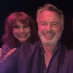 Bryce Dallas Howard Instagram - Call me DJ 100 😎 I’m absolutely honored to be the 100th DJ on the Two Paddocks Day-Glo Disco with @samneilltheprop!! You can listen to my Top 10 Tunes at the link in bio 🔗⁣ ⁣ Not gonna lie, narrowing down to a list of 10 sent me onto an existential spiral. My remedy (other than avoid the assignment) was to pick favorite songs from different times in my life. Whenever one of these songs plays, it always brings up fond memories — from my wedding song (Amélie soundtrack) to my first feature as a producer (@sufjan’s “Concerning the UFO sighting…”), to my favorite musician from high school (@benleemusic)! ⁣ ⁣ Take a trip down memory lane with me and click on that link in my bio — I hope these songs bring a smile to your face:)⁣ ⁣ [ID: In pink lighting, BDH peeks over Sam Neill’s right shoulder for a smiling selfie.]
