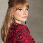 Bryce Dallas Howard Instagram - What a memorable night surrounded by friends and collaborators I so admire 🤩 Thank you @vanityfair & its fearless leader @radhikajones for including me. ⁣ ⁣ Over 20 years ago I got to intern at Vanity Fair so I know how much thought and care goes into creating a space for our community to celebrate — congratulations to all involved!! #VFOscars #VanityFairOscarParty⁣ ⁣ Thank you @quinnmurphy, @misterjasonlow, and @alex.schack for making me feel pretty. Dress by Alaïa — consignment never fails ♥️ ⁣ ⁣ 📸 3: @gettyentertainment⁣ & @vanityfair ⁣ [ID: BDH all glammed up and glowing with excitement on the Vanity Fair blue carpet. She wears a long red Alaïa dress with a red rose lace print and black pumps]