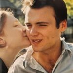 Bryce Dallas Howard Instagram - Celebrated 22 years together yesterday. We didn’t make plans and I’ve gotta say, it was our best anniversary yet. We reminisced, we took a walk, we watched episodes of our favorite show from the earliest days of our relationship (“Nigella Bites”). Late in the evening, before we each gave the other permission to do the thing we wanted to do (for me watercolor; for him play video games), we talked about the dreams we held for next 22 years (if we should be blessed enough) and it was kinda wild and amazing to imagine the possibilities. I love you Seth Gabel — thanks for going on that date 22 years ago. I still own the sweater I wore that night because I JUST KNEW.⁣ ⁣ Happy Anniversary ⁣ ⁣ [ID: A close up of BDH (left) and Seth (right) from their college years. BDH kisses Seth on the cheek and Seth smiles]