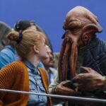 Bryce Dallas Howard Instagram - Reunited. And it feels SO GOOD! It’s an honor to have been invited back to direct on the new season of #TheMandalorian — there’s nothing quite like the adventure, magic, and friendships forged on this show 🥹 Swipe to watch the trailer for season three and mark your calendars for the premiere on March 1, only on #DisneyPlus 💫⁣⁣⁣ ⁣⁣⁣ [ID: BDH in various states of glee on the Season 2 set of The Mandalorian: casually hanging out with a Quarren on giant trawler, talking to the iconic Frog Couple on the docks of Trask, and watching the monitor at video village.]