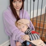 Bryce Dallas Howard Instagram - This baby boy turns 16 today and I LOVE HIM SO MUCH! Happy Birthday Theo!!!! Mumsie and Whoopsie love you ❤️⁣ ⁣ [ID 1: At the kitchen table, young Theo sits in BDH’s lap. They both smile softly as BDH gently rests her head on top of Theo’s.]⁣ ⁣ [ID 2: Sitting on the floor in comfy pajamas, BDH cradles a young Theo in her arms. BDH wears a fluffy light purple robe and Theo wears matching striped shirt and bottoms.]
