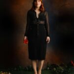 Bryce Dallas Howard Instagram - “If I had a single flower for every time I think about you, I could walk forever in my garden.” ~ Claudia Adrienne Grandi⁣ ⁣ Don’t think that I missed the uptick in new followers — grateful to new folks joining this online family ❤️🌺⁣ ⁣ [ID: On a photo stage, BDH stands in a grassy garden holding a red flower that matches the fire of her hair. She wears a black long skirt and black sheer top.]⁣ ⁣ 📸: @leeorwild for @rollingstone