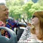 Bryce Dallas Howard Instagram - Happy Birthday to the man with a timeless sense of style, humor, grace, and genius — @jeffgoldblum, you are truly one of the greats!! 🥳🎂 ⁣ ⁣ [ID: Jeff Goldblum and BDH talking and smiling while on an open-air bus in Mexico City for #JurassicWorldDominion press. Jeff wears a multi-colored shirt with vibrant patterns and BDH wears a white dress with black spots] 📸: @universalpictures