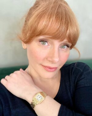 Bryce Dallas Howard Instagram - I wore this beautiful Panthère de Cartier watch all around the world while traveling for Jurassic — and always kept it set to Pacific Time so I knew when to call home 💛 ⁣
⁣
My adventure with @cartier started 16 years ago with my first short film as a director, “Orchids,” sponsored by Cartier and Glamour Magazine. I distinctly remember trying to keep my cool as I picked the watch for Alfred Molina and necklace and earrings for @katherinewaterston to wear. And since then, to mark significant occasions in my life, my husband has always known to go to Cartier.⁣
⁣
From supporting my first film all those years ago to lending me this exquisite watch today, thank you @cartier for keeping me present, punctual, and in style. #NotAnAd⁣
⁣
[ID: BDH in a navy blue sweater poses for a photo, featuring a gold Panthère de Cartier watch on her left wrist.]