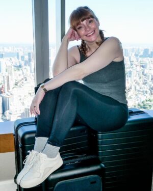 Bryce Dallas Howard Instagram - @away suitcases = press travel essentials. Thank you for making my travels as easy (and glamorous) as can be ❤️ Not an ad, just super grateful ☺️⁣
⁣
[ID: In a hotel room getting ready for her flight, BDH sits on top of her gifted Away black Flex suitcases.]