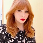 Bryce Dallas Howard Instagram - 💋💋💋⁣ ⁣⁣ Makeup: Kate Synnott (@katesynnottmakeup)⁣ ⁣ Hair: Bobby Eliot (@bobbyeliot)⁣⁣ Dress: @altuzarra⁣ Shoes: @ysl ⁣ 📸: Bobby Eliot⁣ ⁣ [ID: Taking advantage of the sunny day outside, BDH poses in a flowy, black and white tortoise-print midi dress. She pairs the outfit with tall black heels and her favorite shade of red lipstick]
