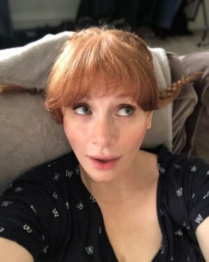 Bryce Dallas Howard Instagram - Getting ready for Halloween 🎃 I’ve been #PippiLongstocking many times, but the wires always become unmanageable… any tips? ⁣⁣
⁣⁣
[ID: Selfies of BDH with French Braids, by Charlie Rogers, perpendicular to her head, Pippi Longstocking style]