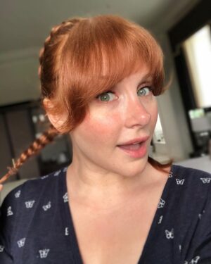 Bryce Dallas Howard Instagram - Getting ready for Halloween 🎃 I’ve been #PippiLongstocking many times, but the wires always become unmanageable… any tips? ⁣⁣
⁣⁣
[ID: Selfies of BDH with French Braids, by Charlie Rogers, perpendicular to her head, Pippi Longstocking style]