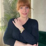 Bryce Dallas Howard Instagram - I wore this beautiful Panthère de Cartier watch all around the world while traveling for Jurassic — and always kept it set to Pacific Time so I knew when to call home 💛 ⁣ ⁣ My adventure with @cartier started 16 years ago with my first short film as a director, “Orchids,” sponsored by Cartier and Glamour Magazine. I distinctly remember trying to keep my cool as I picked the watch for Alfred Molina and necklace and earrings for @katherinewaterston to wear. And since then, to mark significant occasions in my life, my husband has always known to go to Cartier.⁣ ⁣ From supporting my first film all those years ago to lending me this exquisite watch today, thank you @cartier for keeping me present, punctual, and in style. #NotAnAd⁣ ⁣ [ID: BDH in a navy blue sweater poses for a photo, featuring a gold Panthère de Cartier watch on her left wrist.]