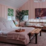Bryce Dallas Howard Instagram - A look inside @brycedhoward’s bedroom! We had so much fun creating this space. Before, it was a drywall box, so to add texture we brought in pink wainscoting and shiplap, matching the cadence already found in this historic home. Bryce uses this room almost like a salon - a creative space to work and collaborate - so I knew we needed a big cozy chair. Enter the @joybird chair and a half! (It really lives up to its name!) And I love the rounded headboard of the Dania bed against the lines of the room. I’m so excited to include @joybird in another project! 💛💛💛#ad #joybird