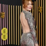 Bryce Dallas Howard Instagram - A magical night at the BAFTAs in London 🎭🪩⁣ ⁣ Hair: @cwoodhair ⁣ Makeup: @kaymontano⁣ Styled by Publicist Extraordinaire: @alex.schack 📸 1+6: @cwoodhair⁣ 📸 2-5: @gettyentertainment @BAFTA ⁣ #EEBAFTAs⁣ ⁣ [ID: Arriving on the red carpet with her hair in a relaxed up-do, BDH wears a silver sequined long-sleeve dress from @newarrivals.co with a cut-out around the waist ending with a black rose. Paired with the dress are a pair of black @maisonvalentino platform heels and a silver beaded bracelet & ring from @bulgari.]