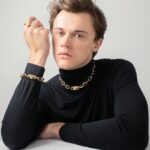 Christopher Briney Instagram - honored and excited to be wearing prada’s 100% recycled gold jewelry from their eternal gold collection. thank you @prada for making me feel all pretty 💕 #pradafinejewelry photos by: @spencerostrander