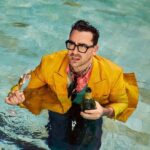 Dan Levy Instagram – Thanks @hollyandres for a very fun/very wet shoot with @vanityfair! 🥂  Styled by @deborahafshani / Grooming by @sydneysollod